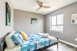Bright Bedroom With A Queen-Sized Bed And Large Windows For Plenty Of Natural Light
