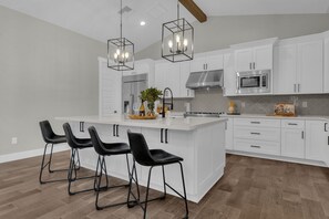 Beautiful open concept kitchen with large refrigerator