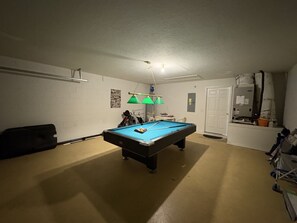 Private game room loaded with fun for all ages, the ultimate hangout spot during your stay.
