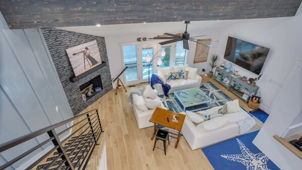 Your entertainment headquarters! Relax in style with our spacious living room, featuring a massive TV and plush, comfortable couches.