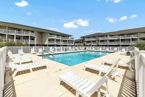 Lounge chairs surround the pool for your sunny day and pool lounging enjoyment. 