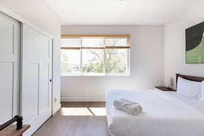 Light-filled secondary bedroom with unobstructed lake views.