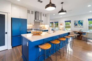 A modern kitchen perfect for home-cooked meals or conversations over snacks!