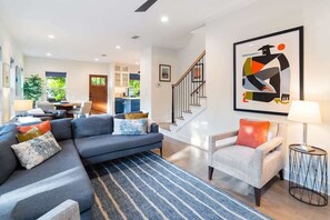 A cozy living area greets you as you enter the home!