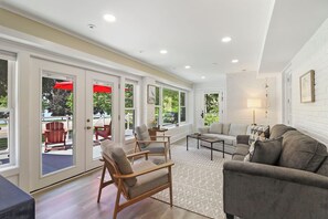 Living room with smart TV, queen sofa sleeper. Entrance to extensive furnished deck, not to mention view of the lake!
