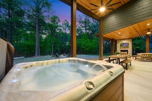 Soaking in serenity: our cabin's hot tub retreat.