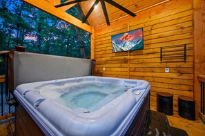 Immerse yourself in comfort and entertainment—our hot tub is your go-to spot for a rejuvenating soak and engaging fun.