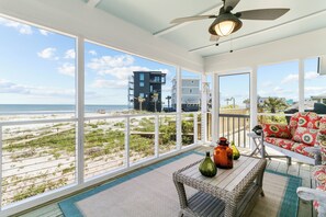 Enjoy breathtaking views of the Atlantic Ocean on the screened in back porch.
