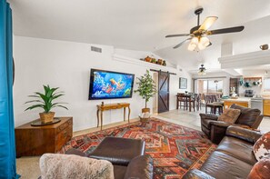 Your home away from home. 75" TV + Leather comfy seating + open floor plan for entertaining.