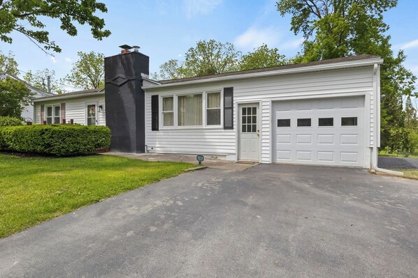 Step into this inviting, well-maintained home, surrounded by lush greenery and featuring a picturesque, shaded yard—perfect for leisurely days outdoors.