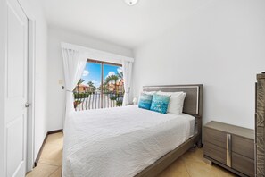 Bedroom 2 features a queen size bed access to the private balcony with glass sliding doors