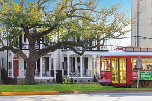 The iconic streetcar on world famous Canal Street stops right in front of both of our 5 bedroom/5 bathroom houses. These houses can be rented separately or together for larger groups.