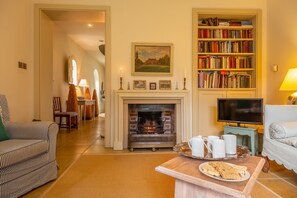 The Engine House, North Elmham: Elegant sitting room with wood burning stove