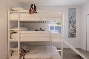 Triple bunk beds for the kids with slide