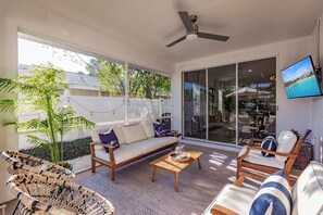 Screened lanai opening to the living room, main master bedroom and pool