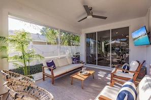 Screened lanai opening to the living room, main master bedroom and pool