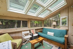 Guests will love the sunroom as an extra gathering space as well as the views