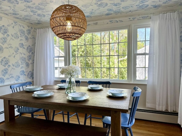 Sunny hydrangea themed dining with a view of the real hydrangeas when in bloom