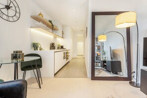 Gorgeous oversized floor mirror really enhances the lounge area.