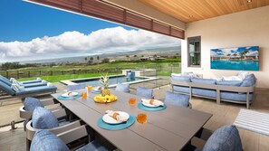 Large covered lanai overlooking private pool, ocean and mountain views.