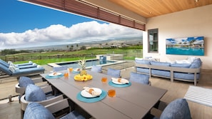 Large covered lanai overlooking private pool, ocean and mountain views.