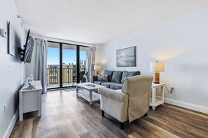 Living room with sliders to the balcony.