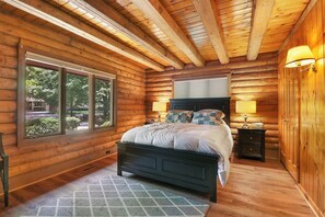 Ground-level front bedroom featuring queen bed