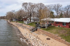 Nice permanent steps to the water. You can see out rollout straight dock (not yet in water, but will be for season). Fire ring too!
