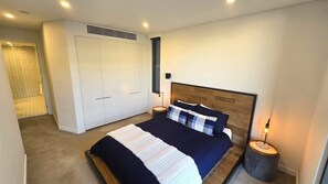 Master bedroom with queen bed and ensuite bathroom