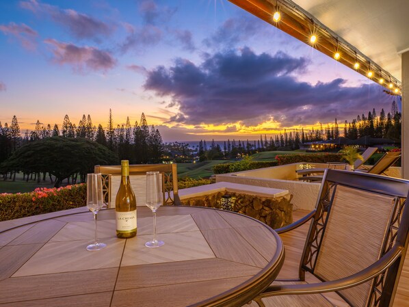 Relax with a glass of wine as you take in the stunning ocean and golf course views during sunset from your private patio.