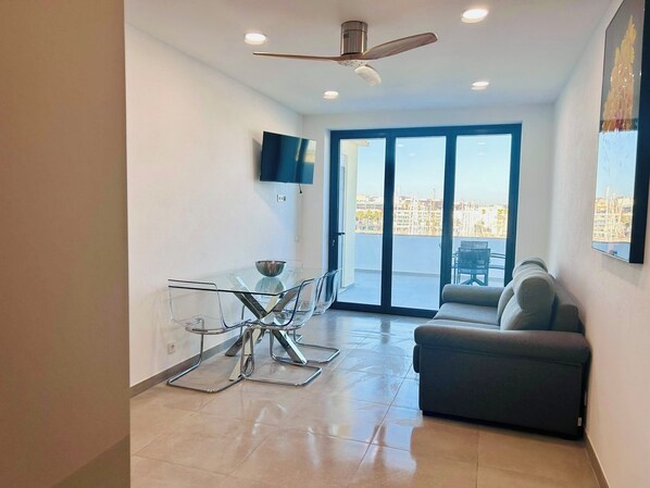 Bright living room with spectacular views of yacht Marina and Promenade 