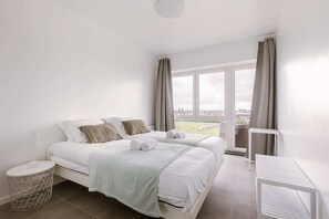 Bright bedroom with double bed