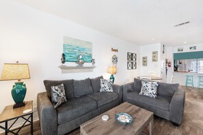 Charming living area with queen size sleeper sofa, twin size sleeper sofa and flat screen TV