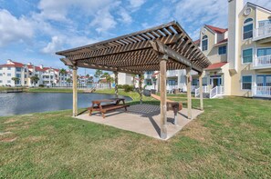 Catch and release pond at Beach Club, with covered picnic and grilling area