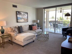 Living room walks out to lanai with water views