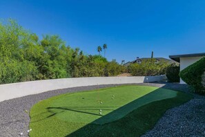 Practice your putting skills on the private green surrounded by peaceful desert landscaping.