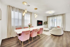 Open-concept living area with seamless flow from the living room to dining area.