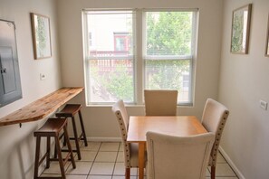 Small dining area with table and bar