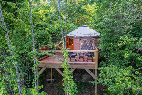 A cozy yurt retreat in the woods.