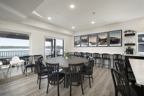 Main Level: Dining Room seating 10 at table and 9 at bar counter