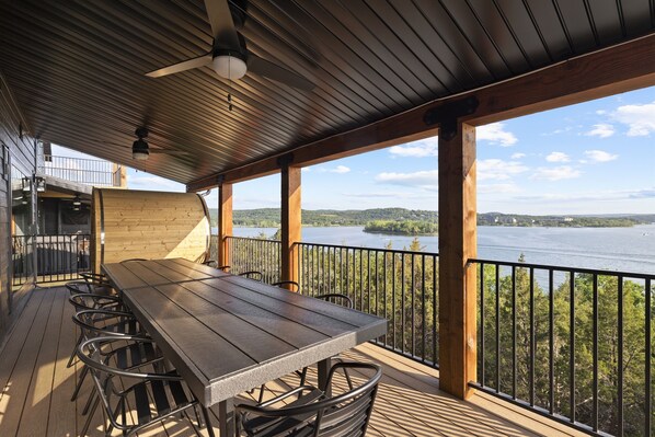 Main Level: Outdoor dining table seating 16 on deck