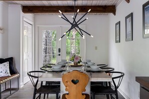The large dining table is perfect for family meals and board games.