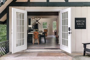 Double doors invite you into the open concept main level. Drawing inspiration from the Alpine influence of the original home design, you’ll find pops of European mountain influence all over the home (like these Tyrolean wood chairs from the Swiss Alps!)