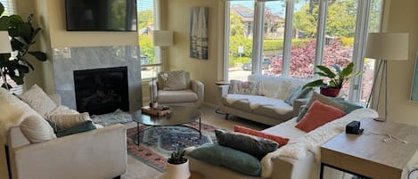 Living room on the main floor. Lots of windows and an open floorplan.