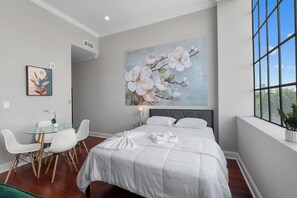 Spacious bedroom with a Queen-sized bed and contemporary design, offering ultimate comfort.