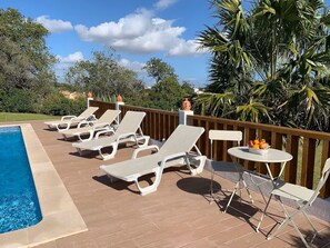 Spacious tile deck surrounding our private pool!