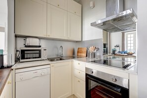 The kitchen is fully equipped to prepare a simple meal