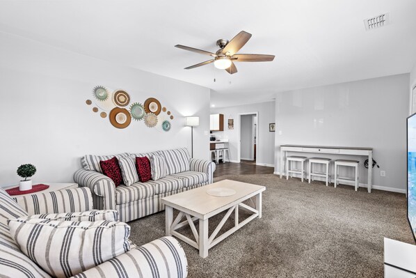 Relax in our spacious living room while escaping the heat!
