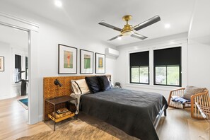 Rest comfortably on the plush Queen-sized bed with luxurious linens.