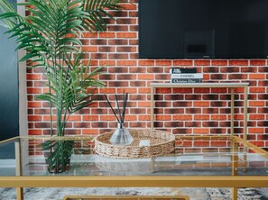 Living room  - 50'  Smart TV loaded with Netflix, HDMI cable, ambient lighting,  extra fast Wi-Fi & a Foosball table - Complimentary tea & coffee available for your enjoyment